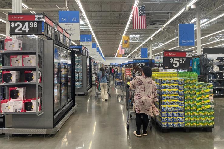 Shoppers browse a Walmart Supercenter in the US.