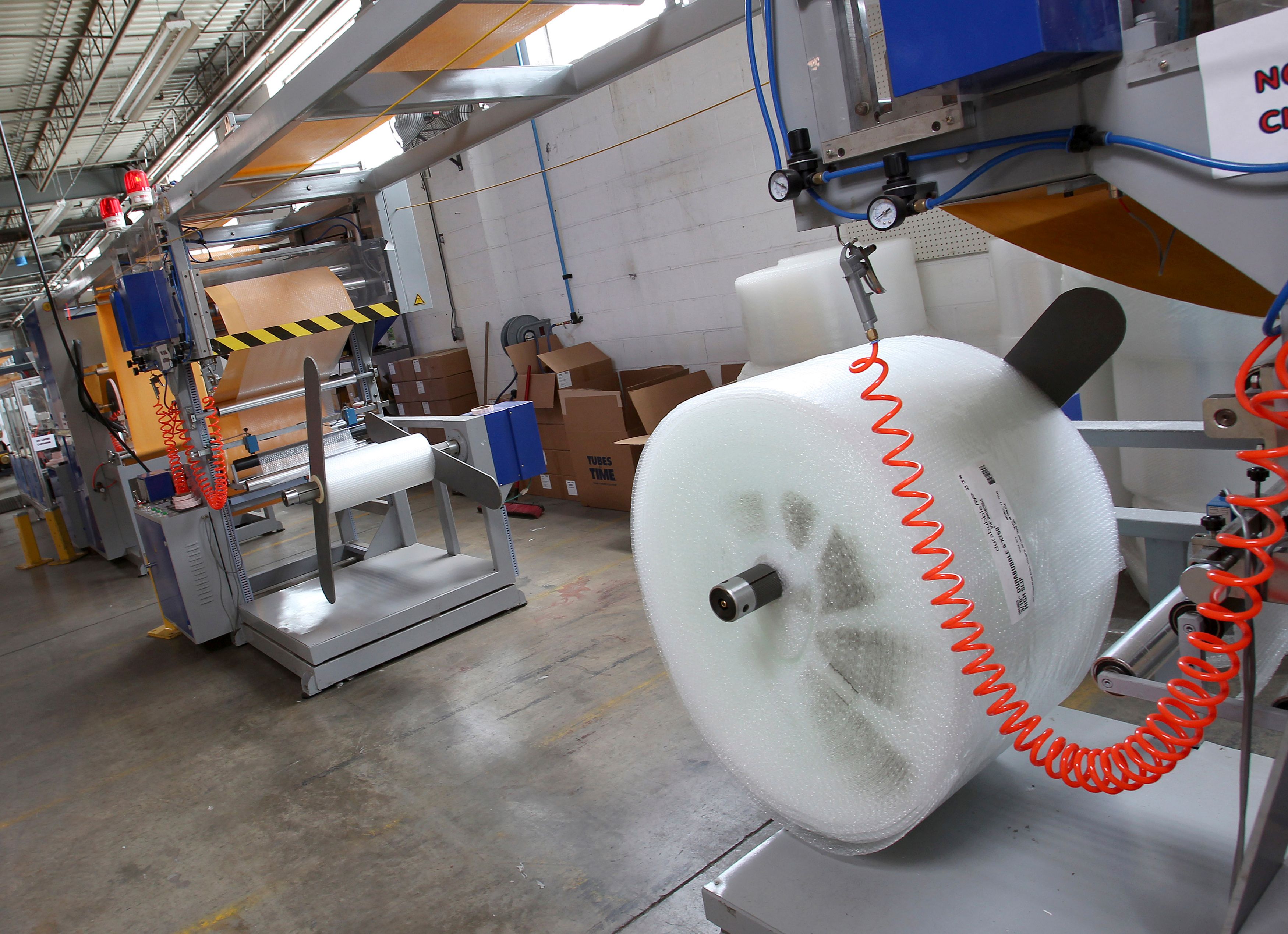 A machine that makes bubble wrap padded envelopes is pictured at the Wrap-Tite manufacturing facility in Solon, Ohio.
