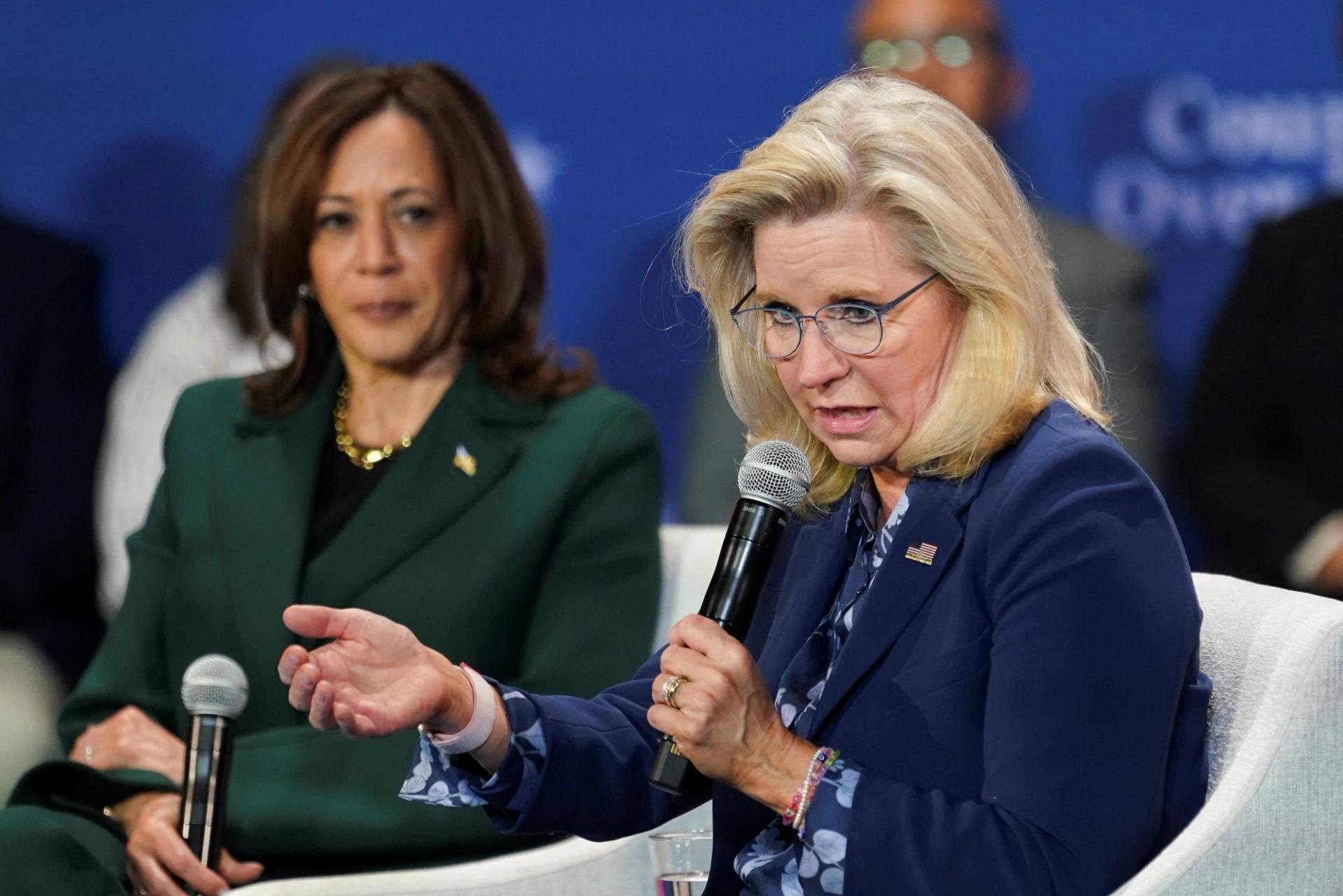 Liz Cheney and Kamala Harris sitting on stage at a campaign event in Wisconsin