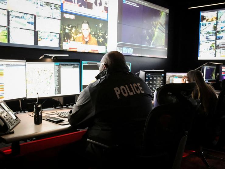 Miami Beach police officers perform surveillance and intelligence operations.