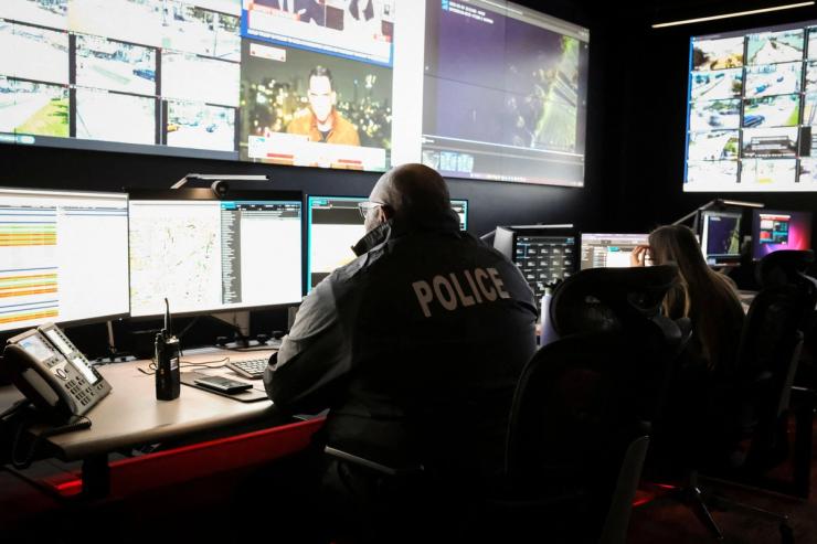 Miami Beach police officers perform surveillance and intelligence operations.