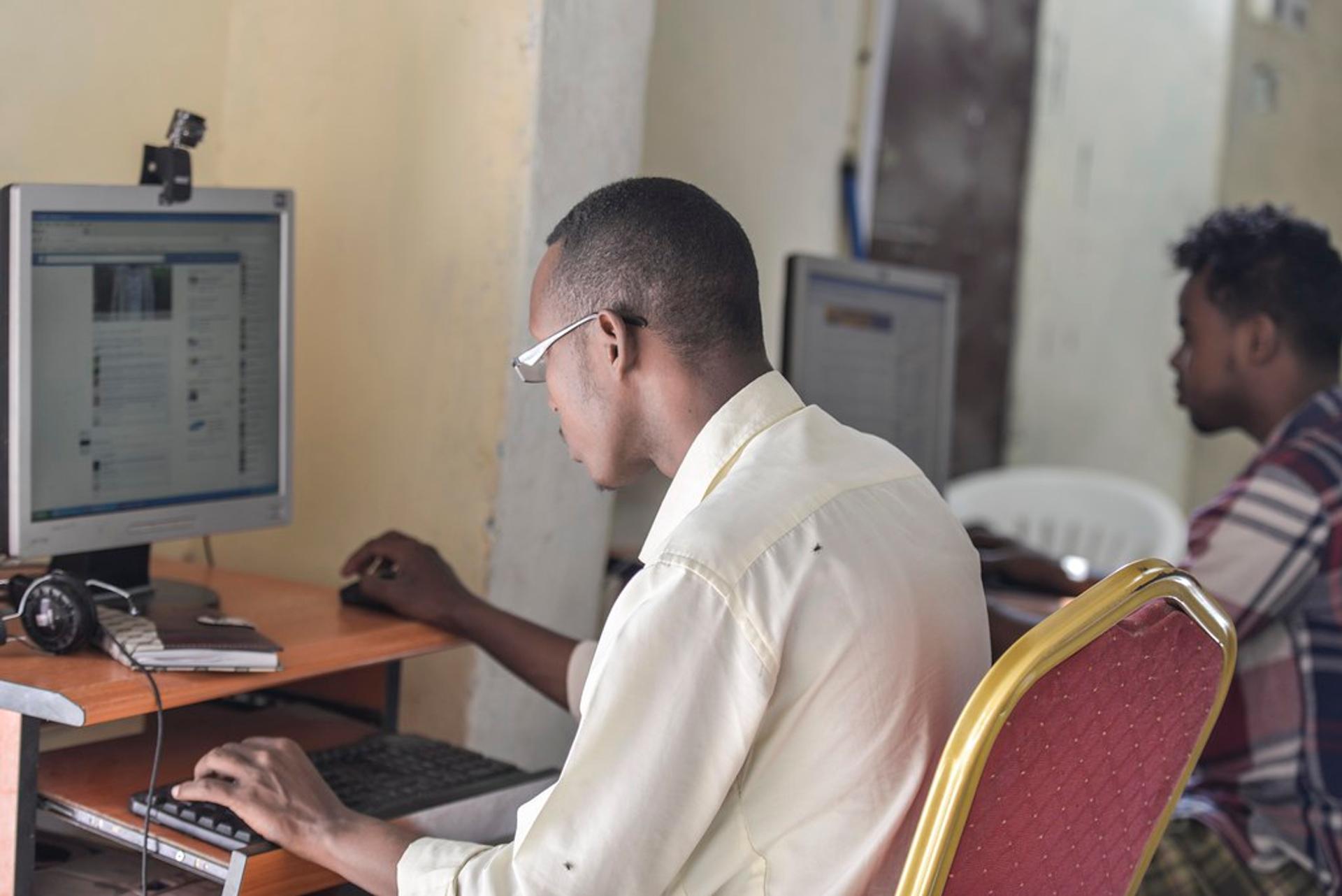 A person using a computer.