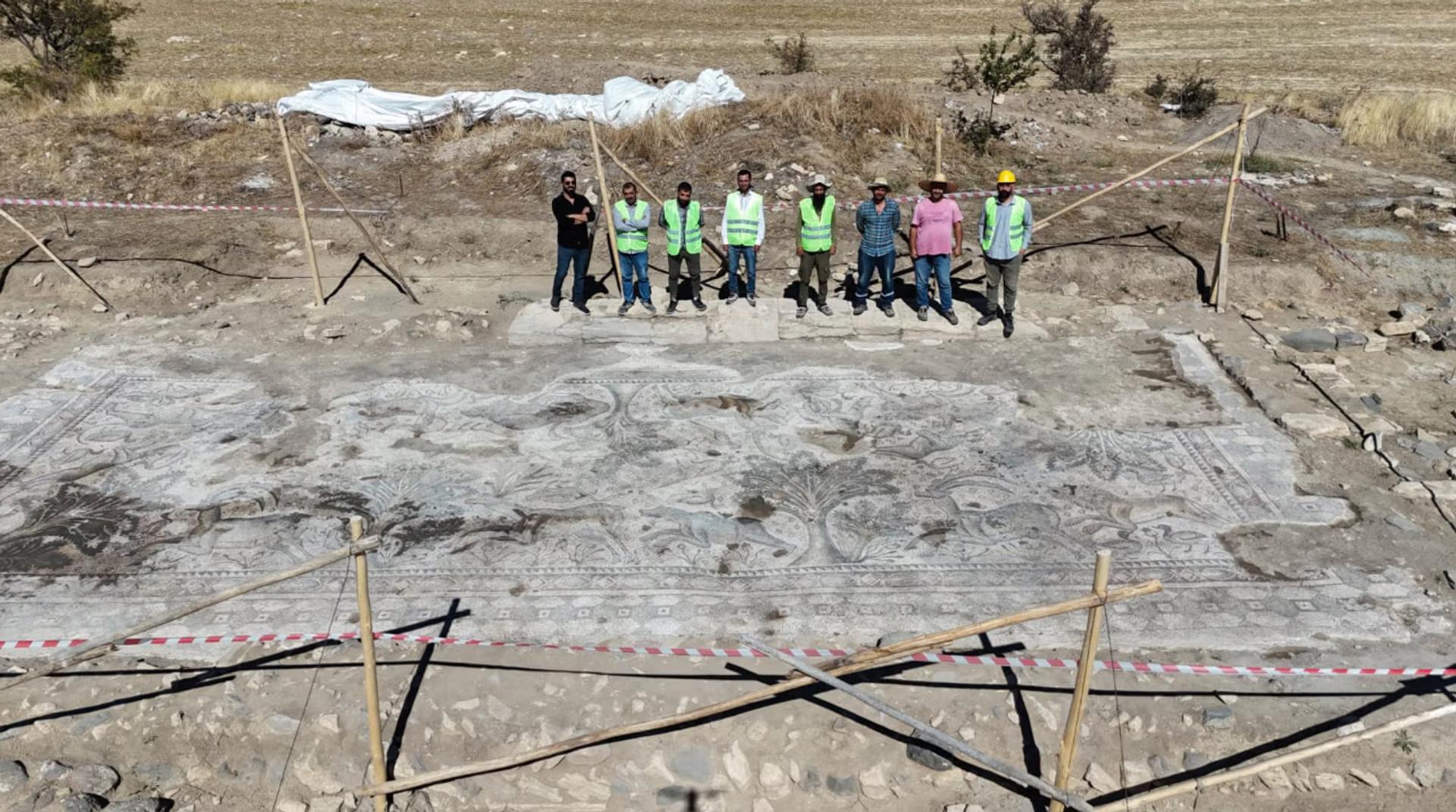 The farmers who unearthed the mosaic. 