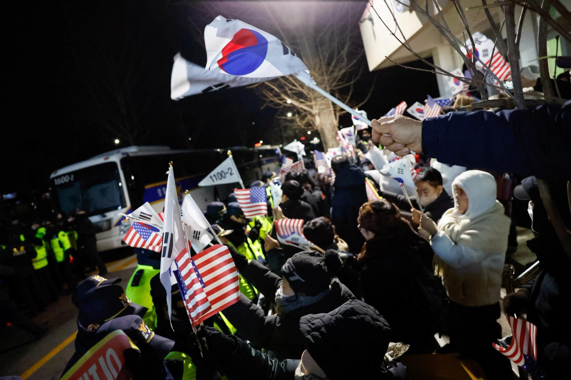 Yoon supporters protest outside a Seoul detention center.