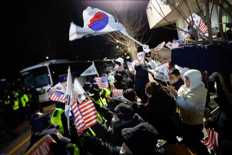 Yoon supporters protest outside a Seoul detention center.