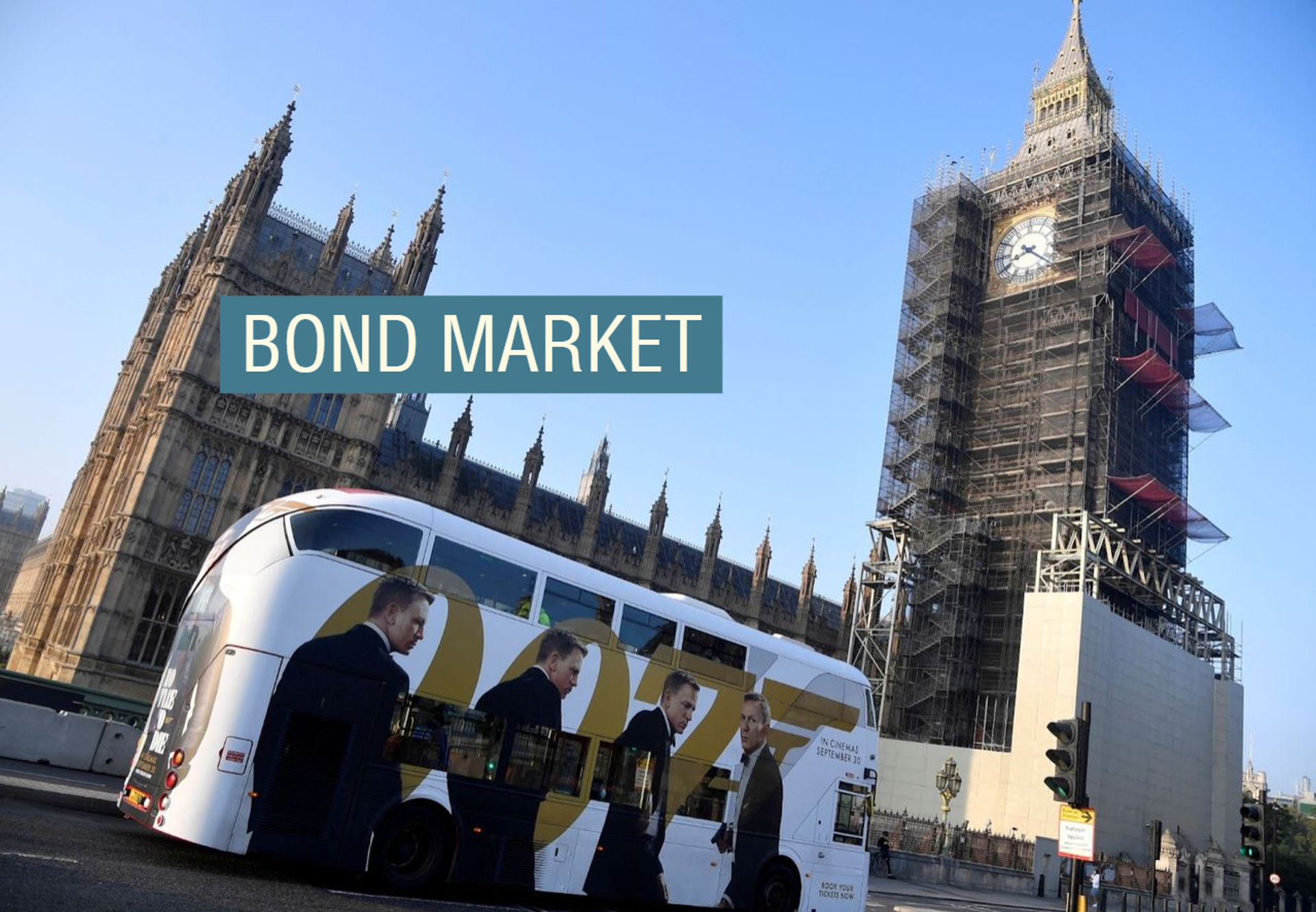 A double-decker bus in London painted with an advertisement for Daniel Craig’s James Bond.