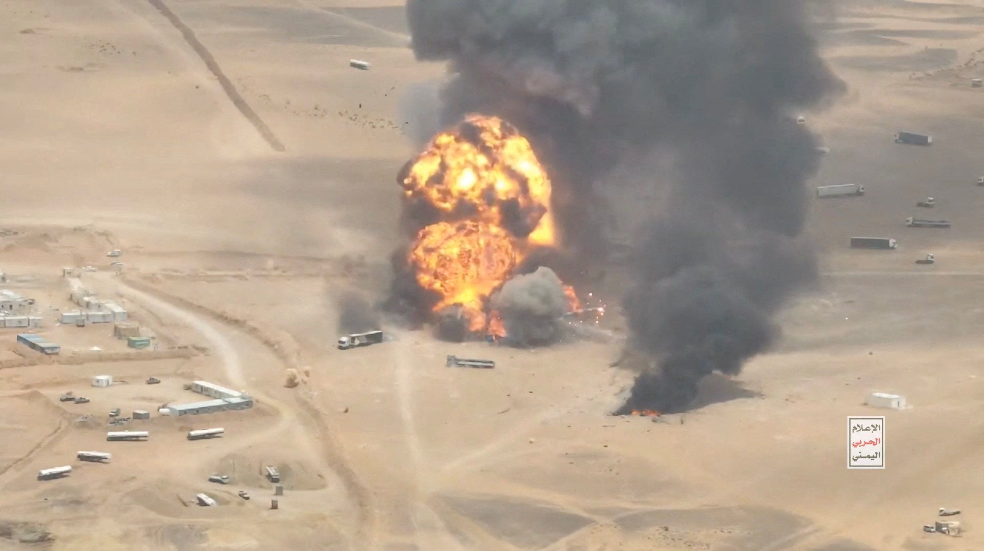 Smoke rises from trucks at Al-Wadiah border crossing on the Saudi-Yemen border.
