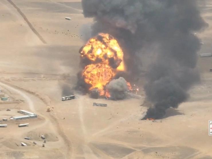 Smoke rises from trucks at Al-Wadiah border crossing on the Saudi-Yemen border.