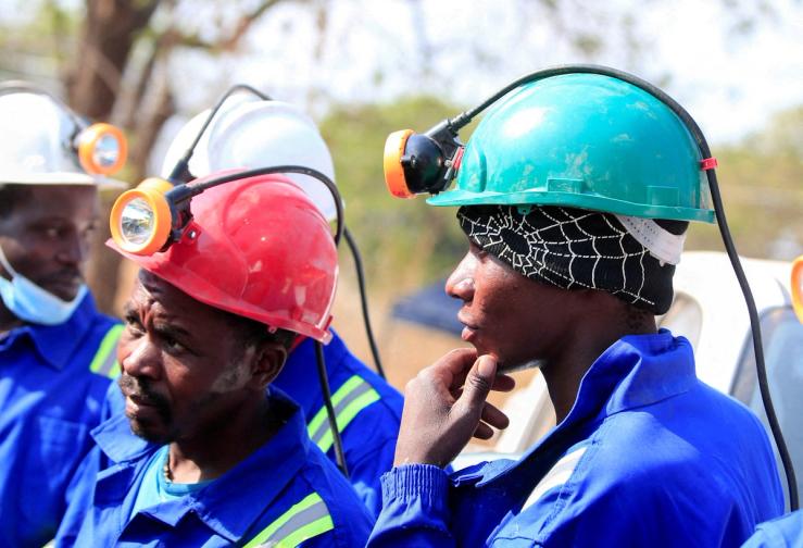 Miners in hard hats.