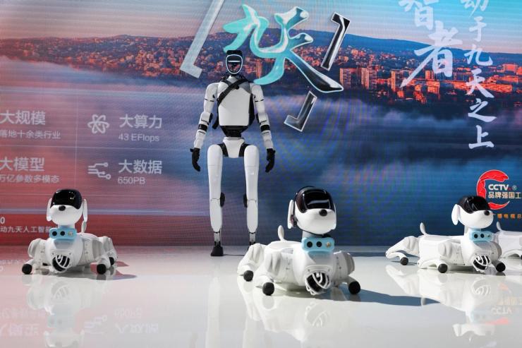 A humanoid robot and robot dogs are displayed at China Mobile booth during WAIC in Shanghai.