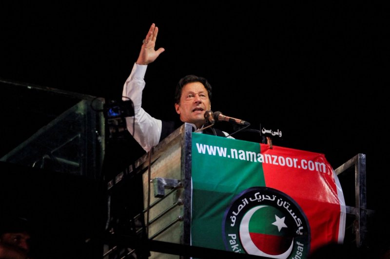 Ousted Pakistani Prime Minister Imran Khan gestures as he addresses supporters during a rally, in Lahore, Pakistan