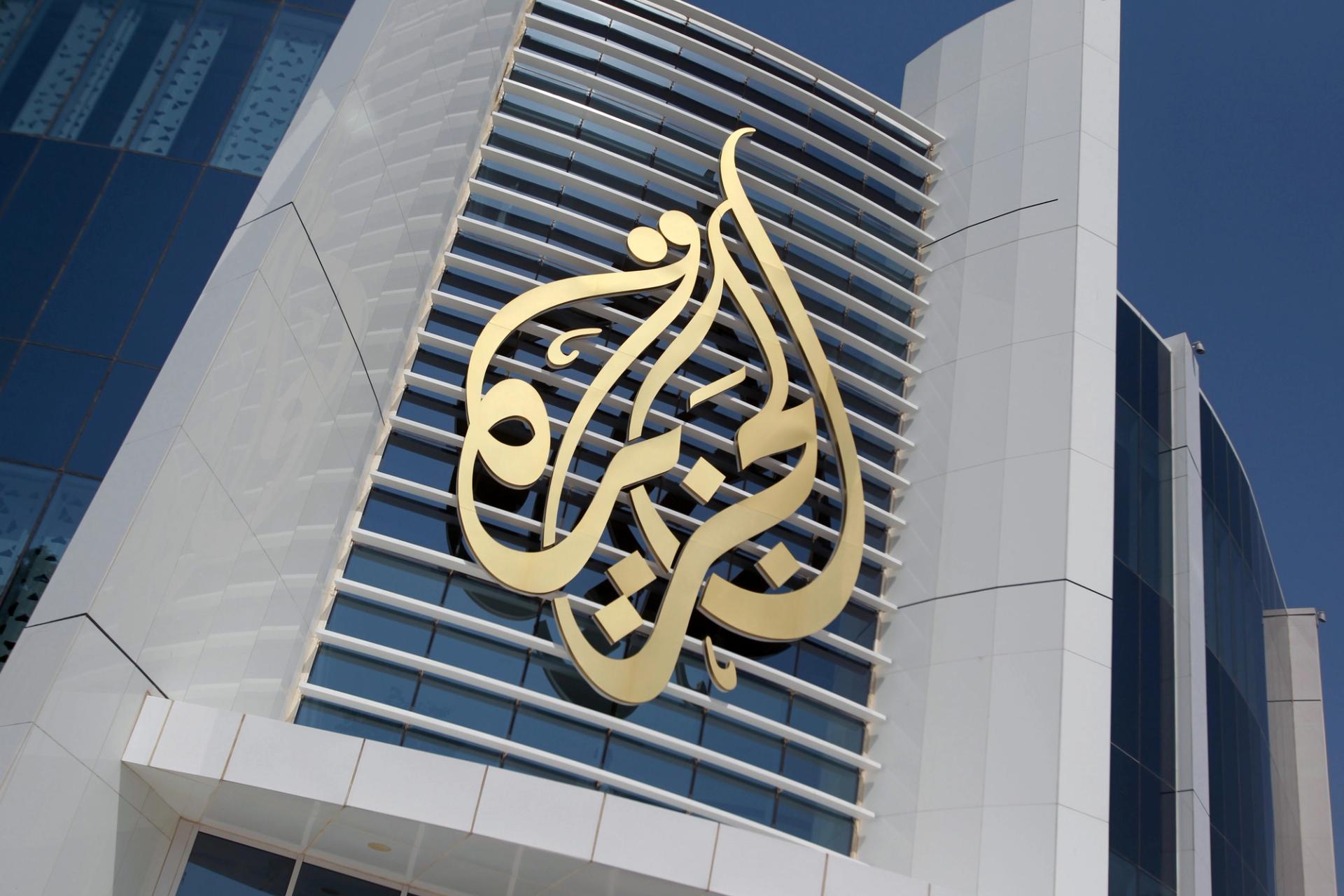 The logo of Al Jazeera Media Network is seen on its headquarters building in Doha.