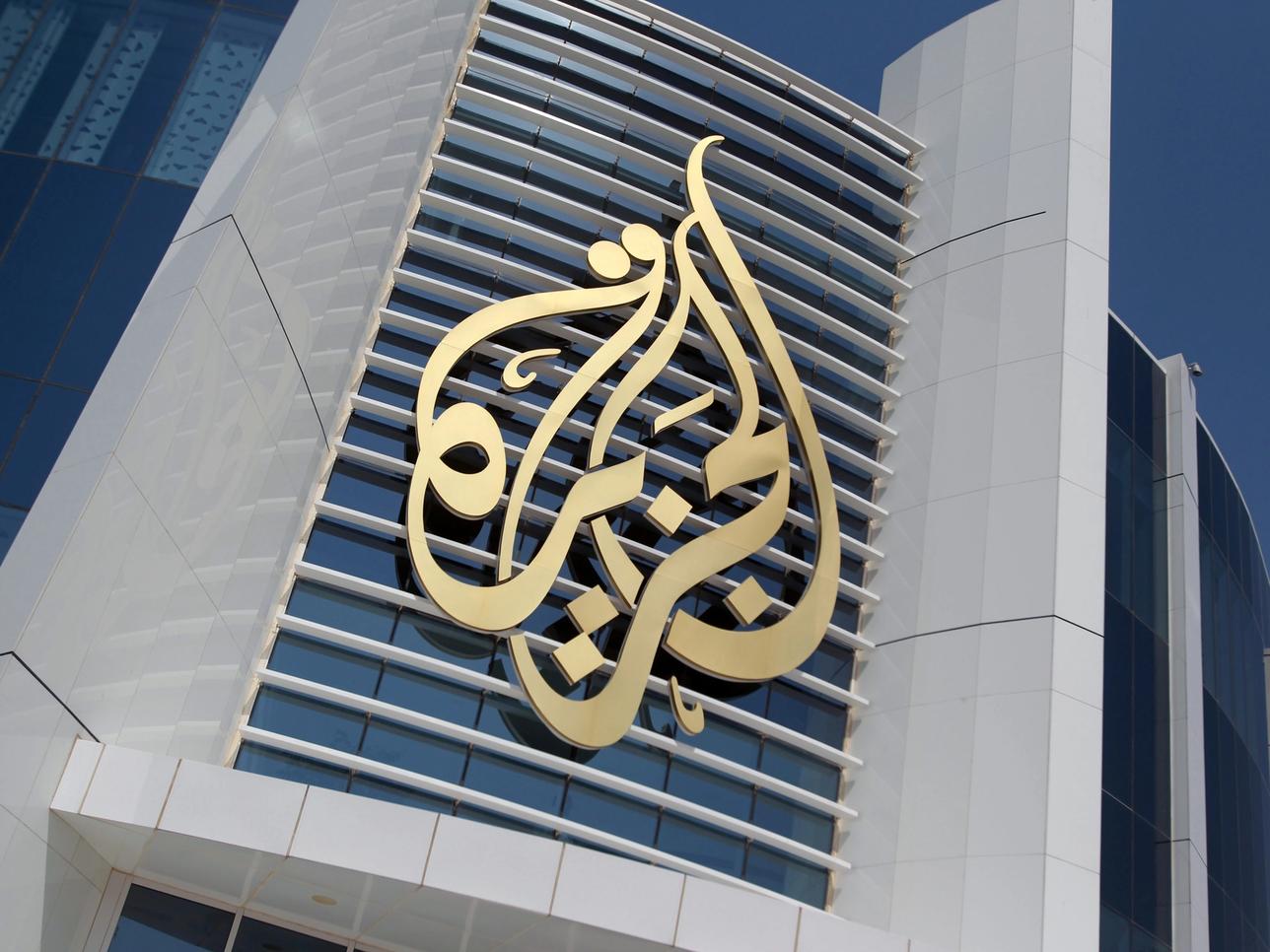 The logo of Al Jazeera Media Network is seen on its headquarters building in Doha.