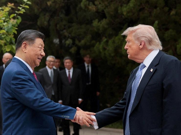 U.S. President Donald Trump shakes hands with Chinese President Xi Jinping while leaving after a visit to the Zhongnanhai Garden in Beijing.