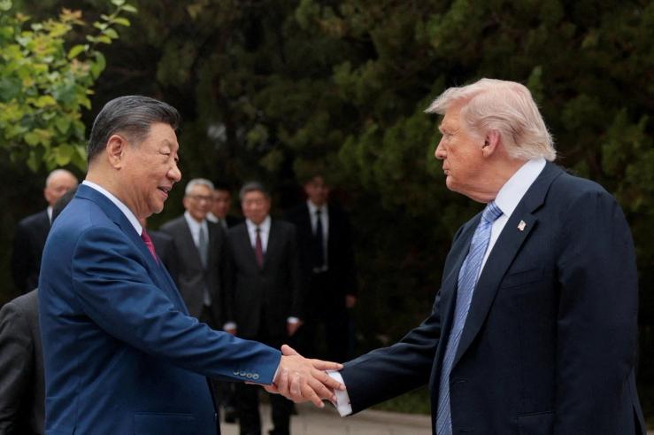 U.S. President Donald Trump shakes hands with Chinese President Xi Jinping while leaving after a visit to the Zhongnanhai Garden in Beijing.
