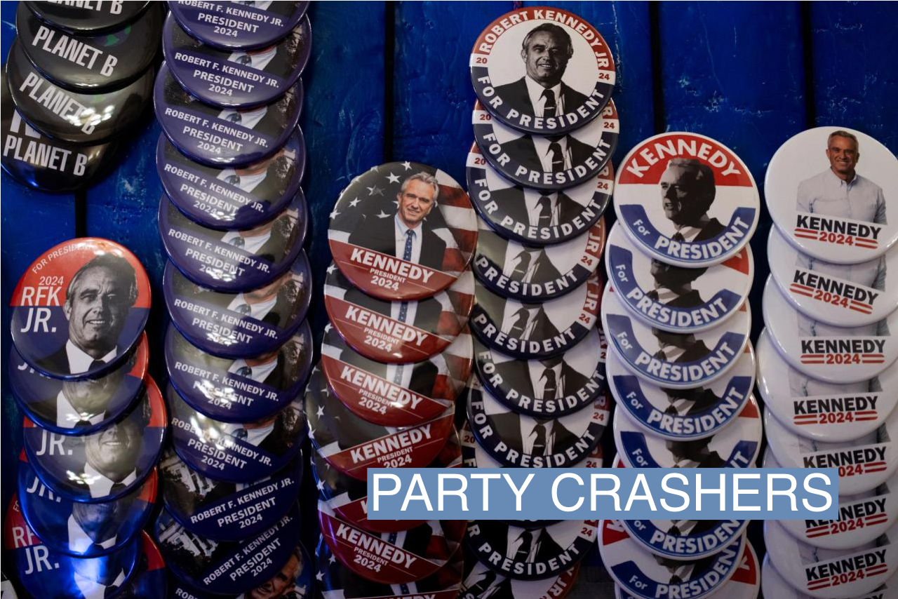 Pins and other merchandise in support of independent presidential candidate Robert F. Kennedy Jr. on display during a voter rally on Feb. 10, 2023 in Grand Rapids, Mich.