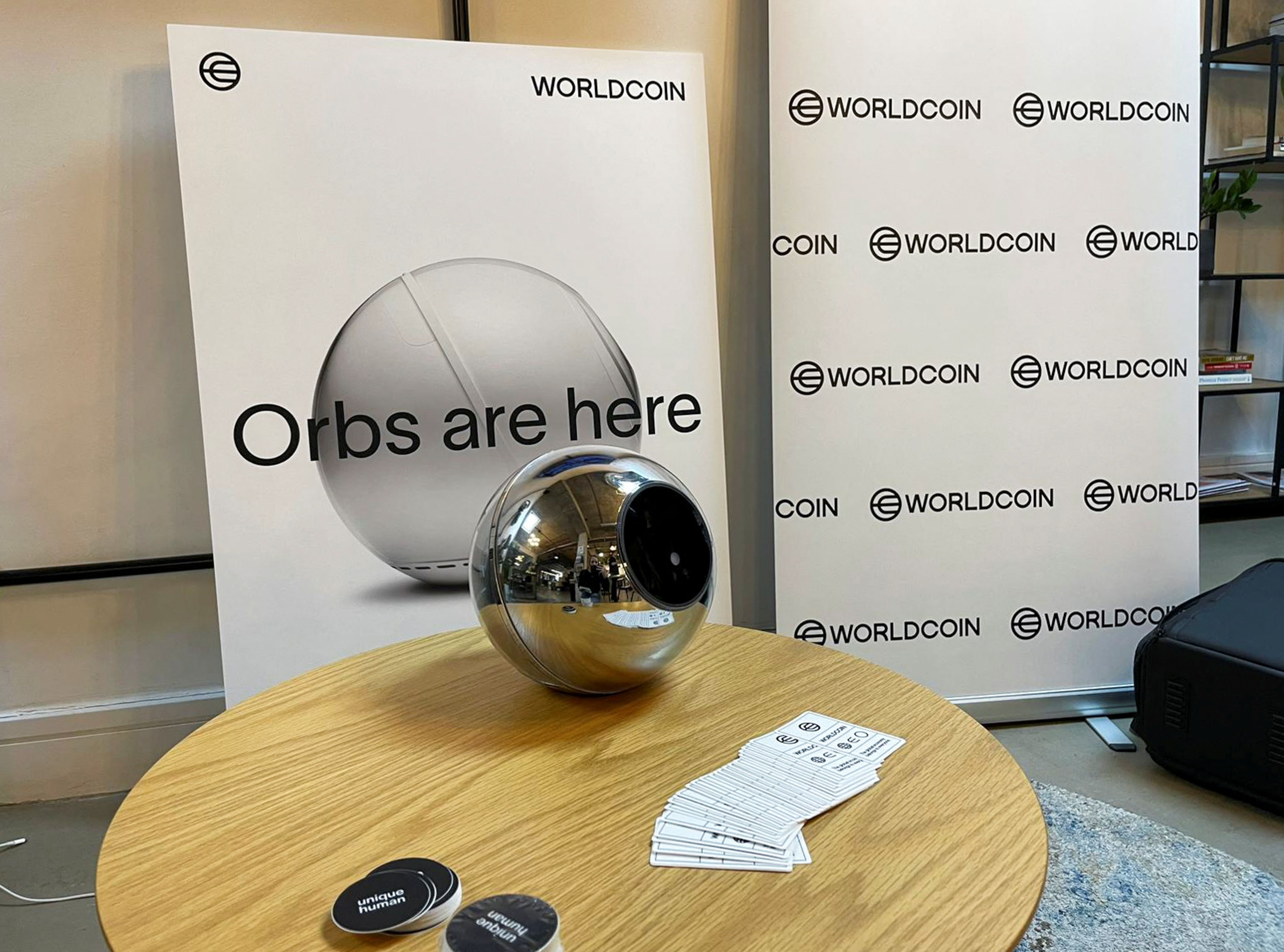 Stickers handed out to people who signed up for WorldCoin are seen at a sign-up site in Shoreditch, East London, Britain.