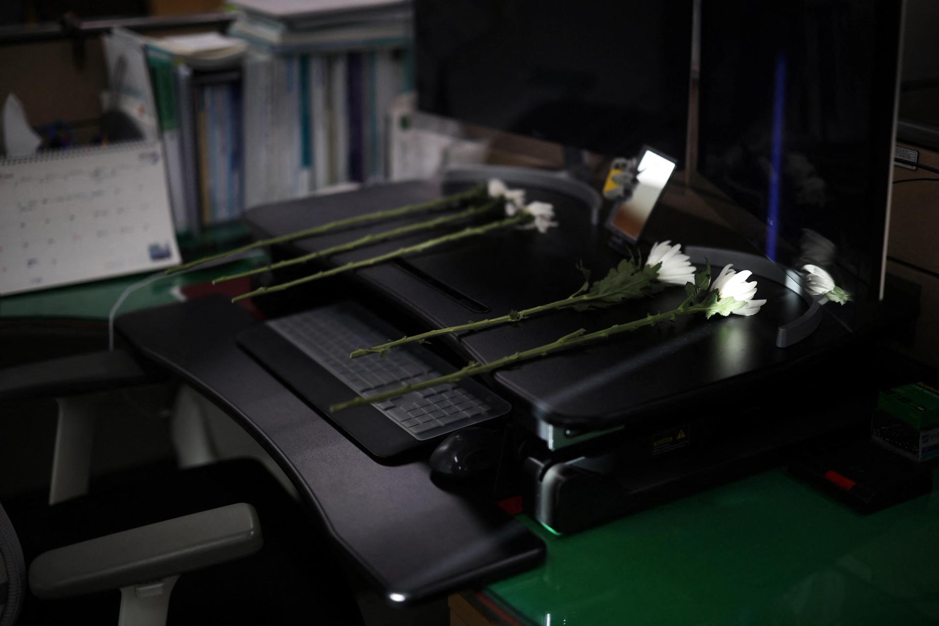 Condolence flowers laid on the desk of a government official who died in the Jeju Air crash.