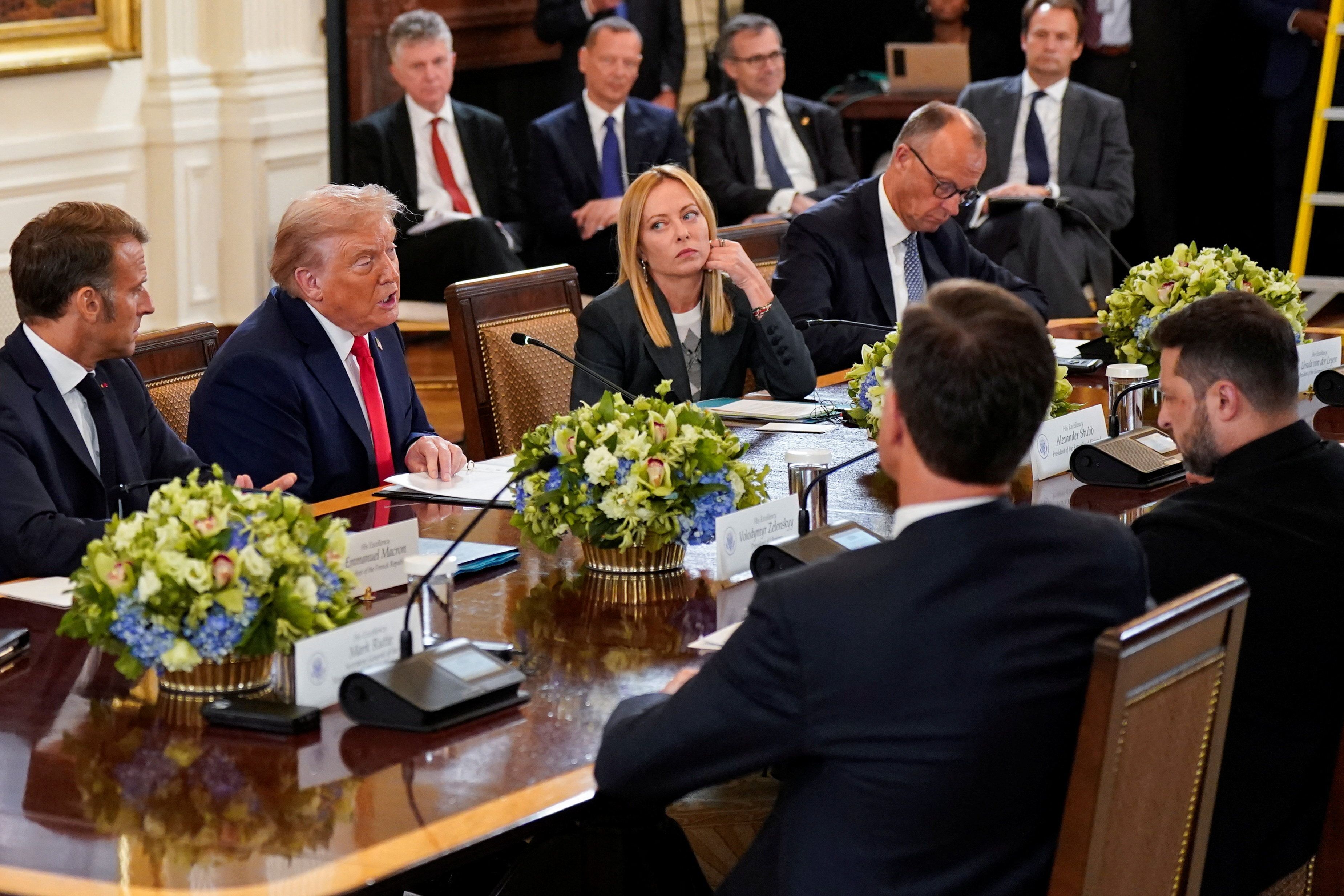 U.S. President Donald Trump speaks during a meeting with Ukrainian President Volodymyr Zelenskiy German Chancellor Friedrich Merz, French President Emmanuel Macron, Italian Prime Minister Giorgia Meloni, and NATO Secretary General Mark Rutte amid negotiations to end the Russian war in Ukraine, at the White House in Washington