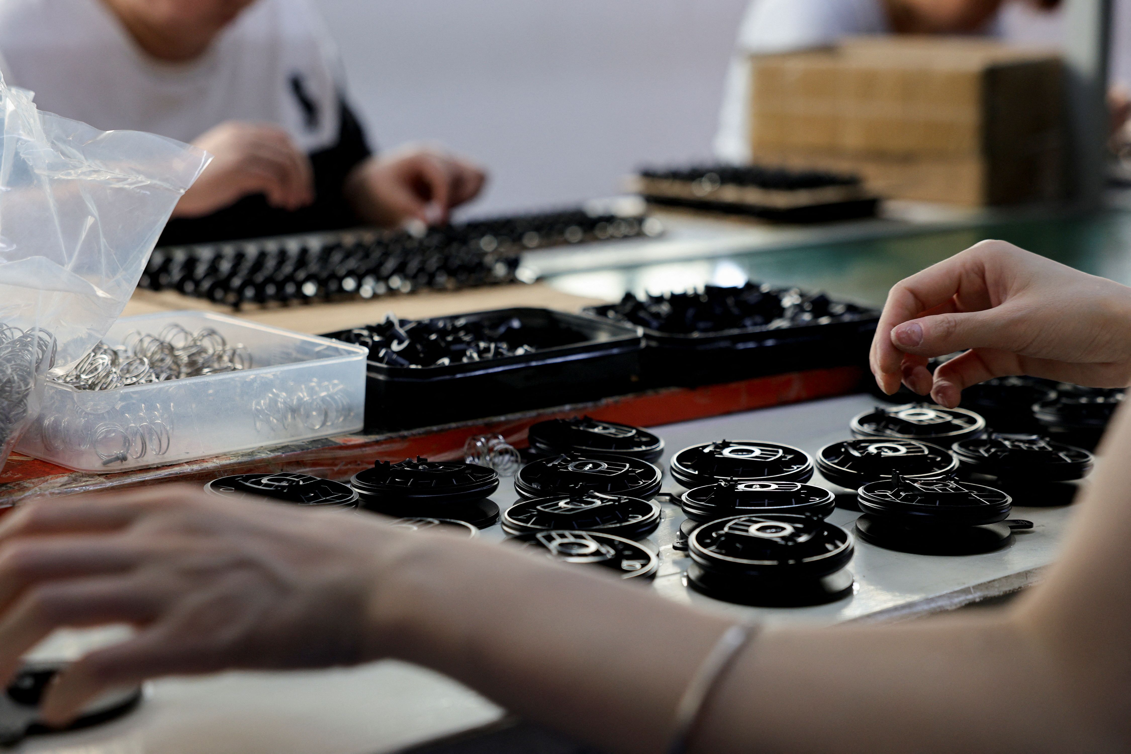 Workers in a Dongguan autoparts factory