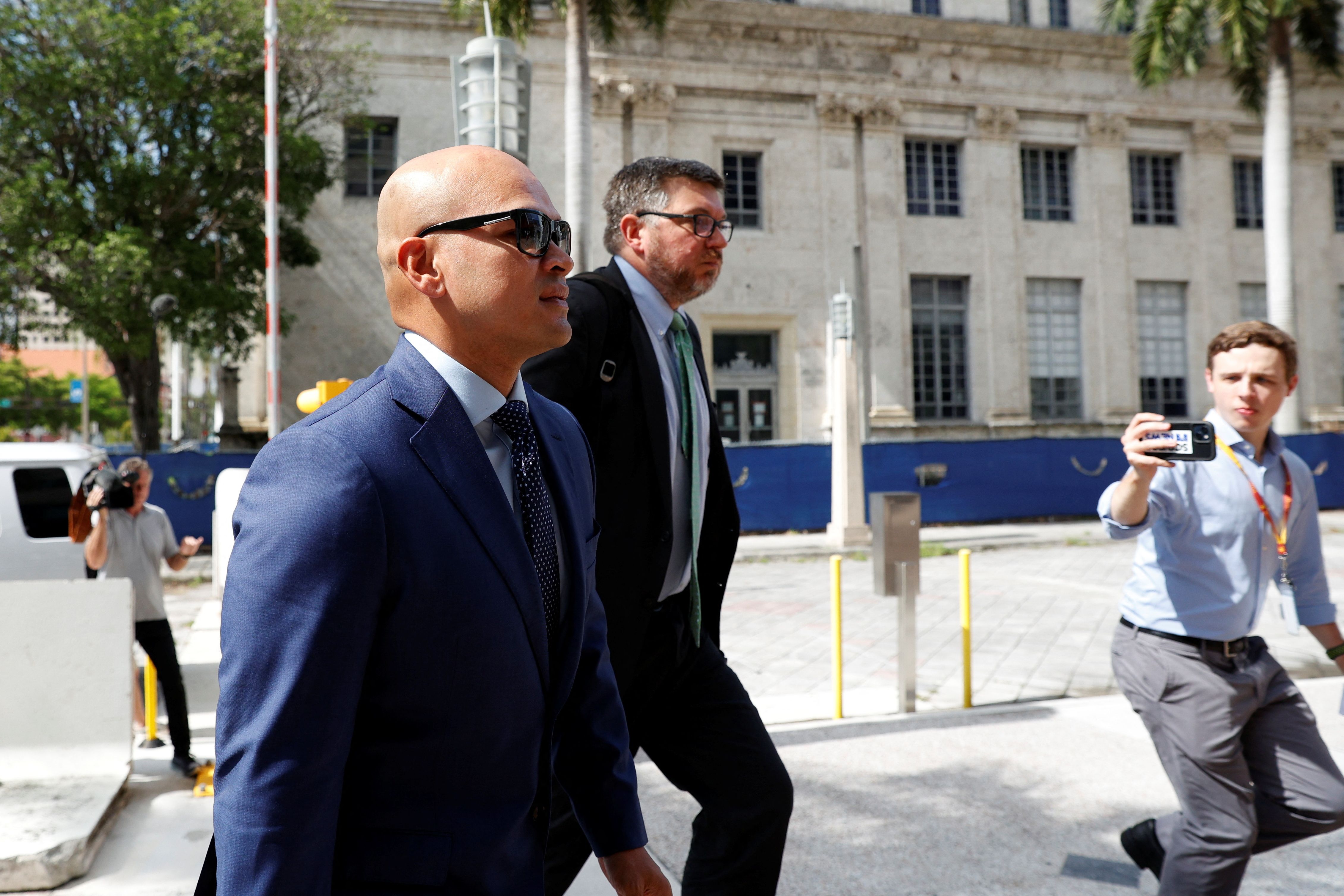 Walt Nauta, personal aide to former U.S. President Donald Trump, who is expected to face charges in connection to the mishandling of classified documents, and his lawyer Stanley Woodward, arrive at the James Lawrence King Federal Justice Building in Miami, Florida, U.S., July 6, 2023.