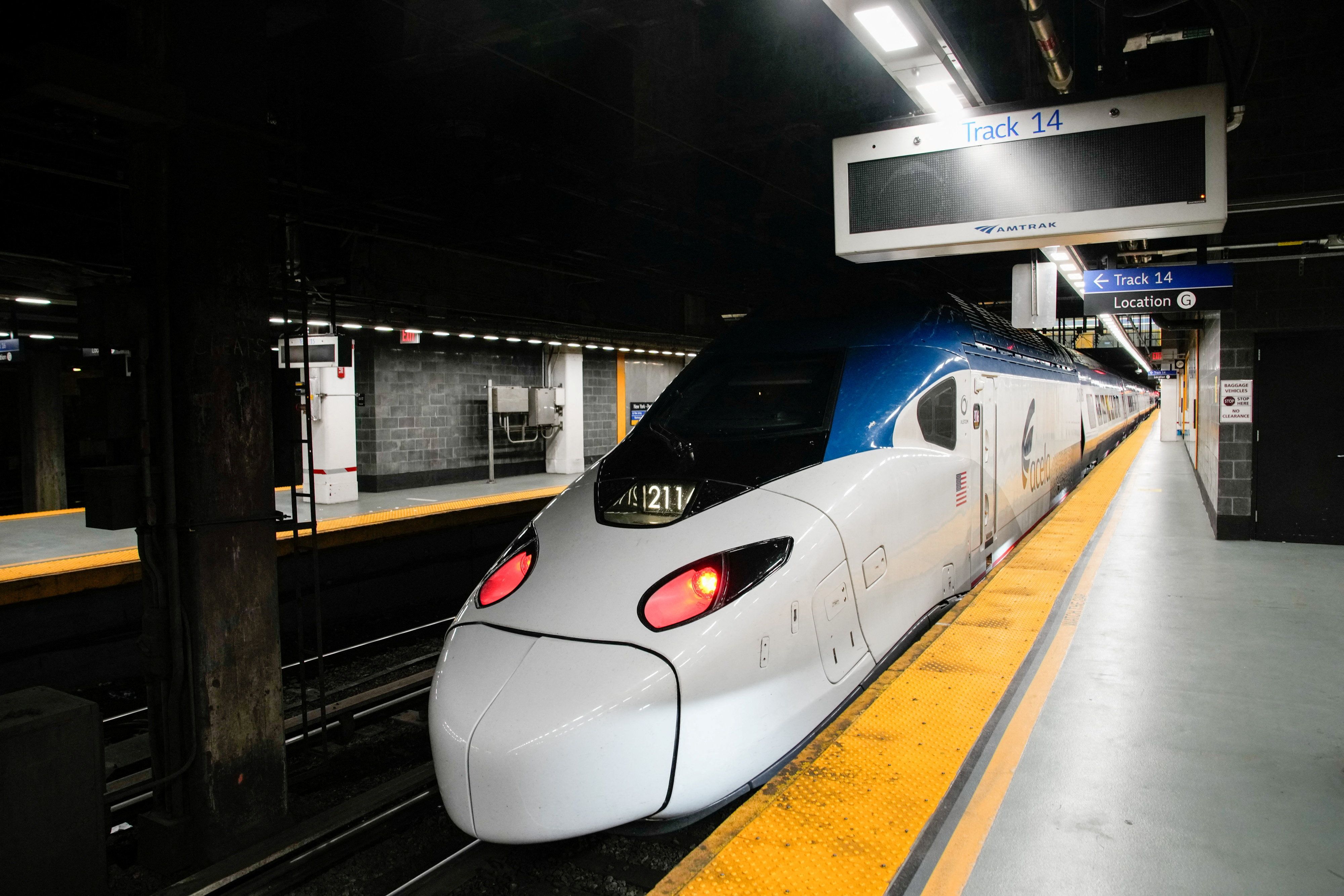 An Amtrak train sits inside Penn Station