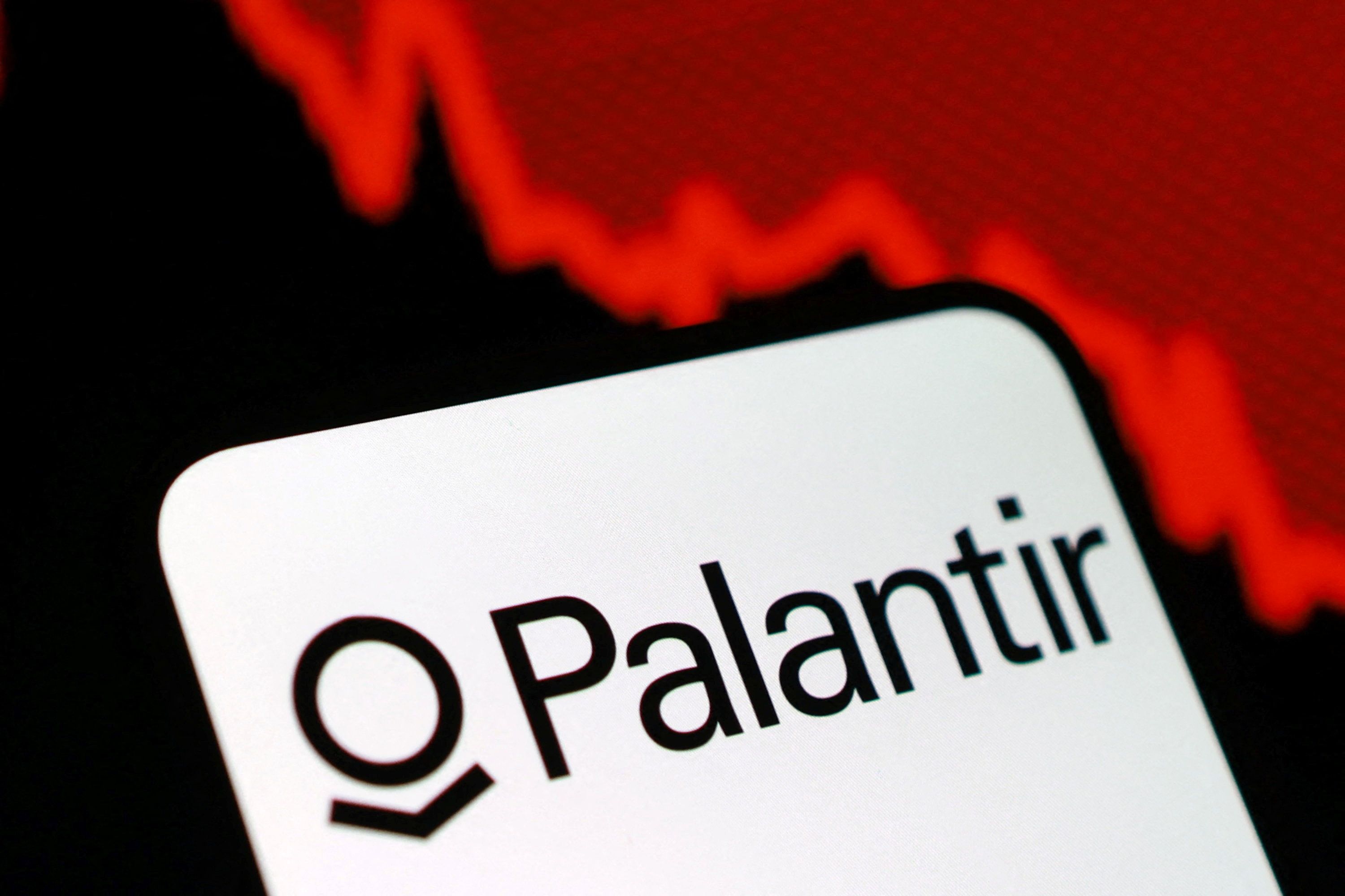 The Palantir logo and a decreasing stock graph