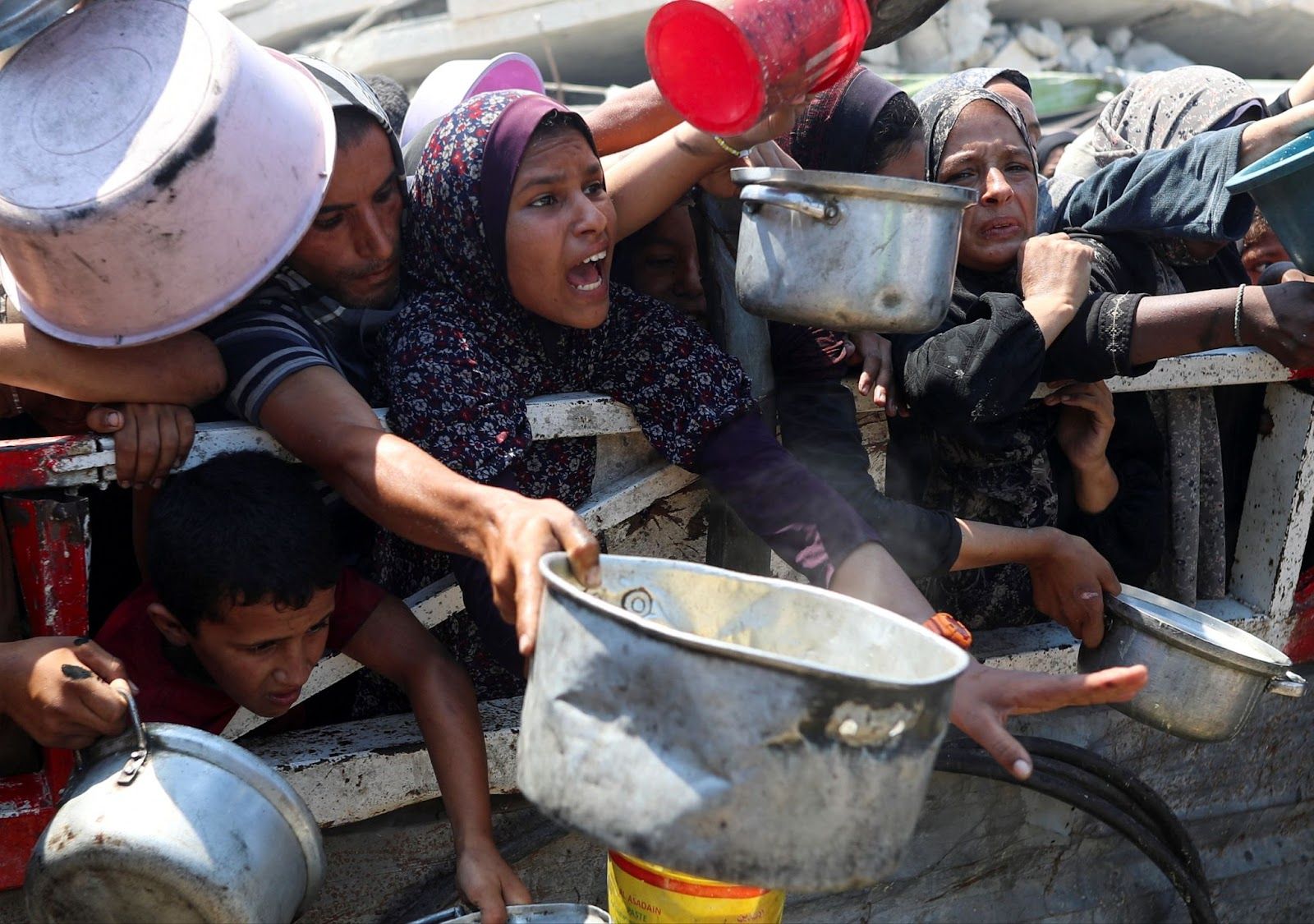 Gazans waiting to receive food aid. 