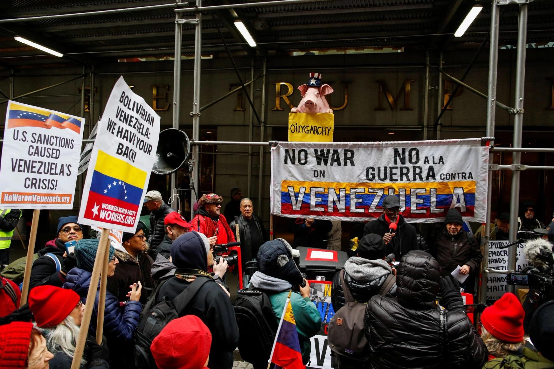 People attend a protest against U.S. foreign policy on Venezuela. 