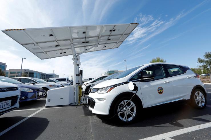 Chevrolet Bolt vehicles are charged by a sun tracking solar panel car charing system in San Diego.