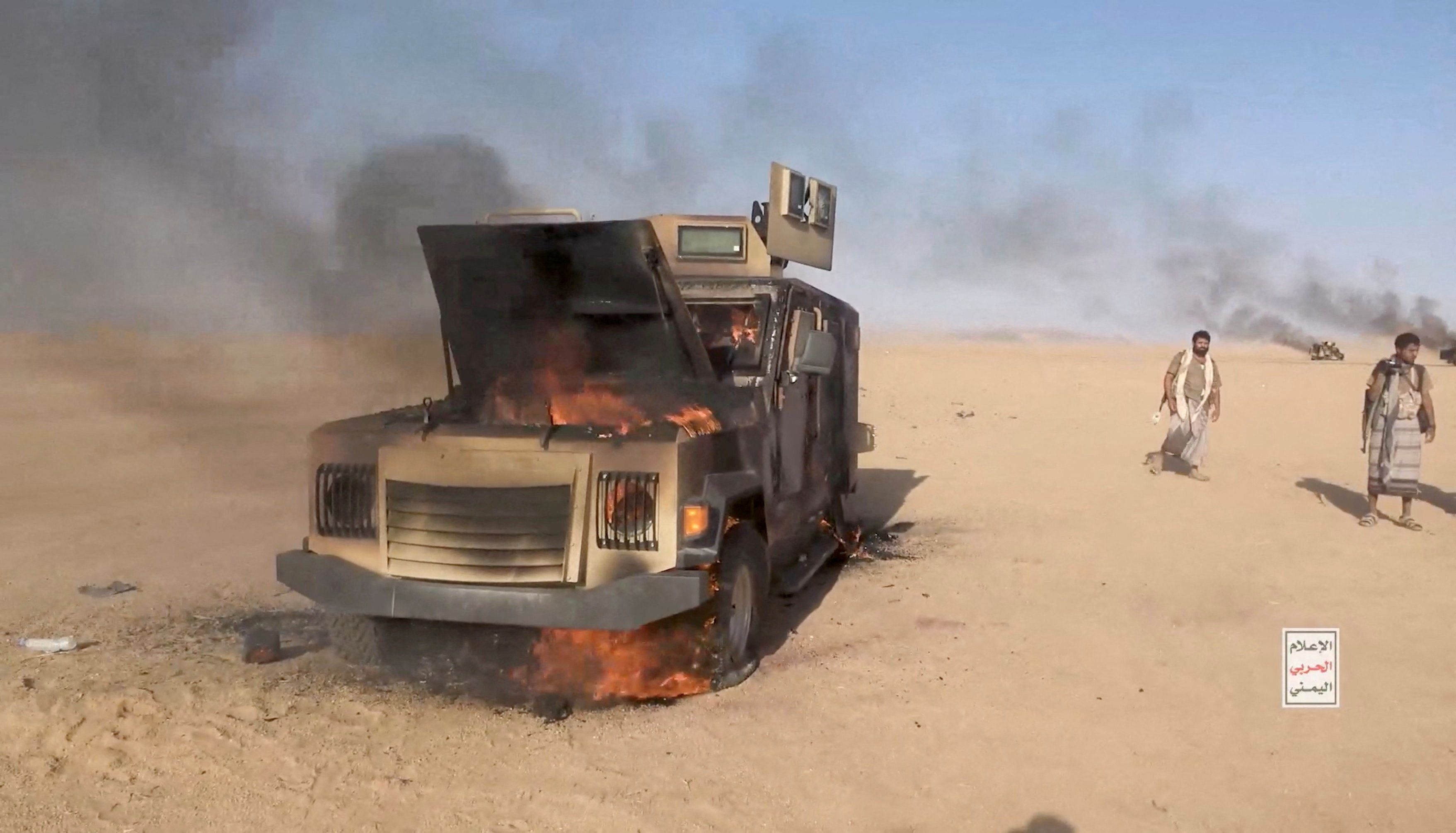 A Saudi military truck on fire. 