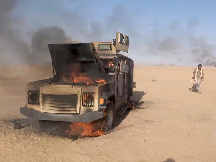 A Saudi military truck on fire.