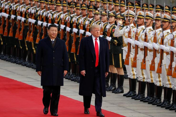 Then-US President Donald Trump takes part in a welcoming ceremony with China’s President Xi Jinping in Beijing, China, 2017.