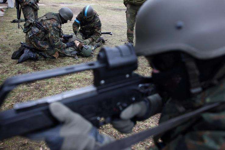 Ukrainian soldiers train to rescue an injured comrade at a training ground in Germany.