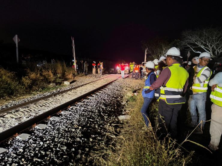 Authorities work at the site of train derailment.