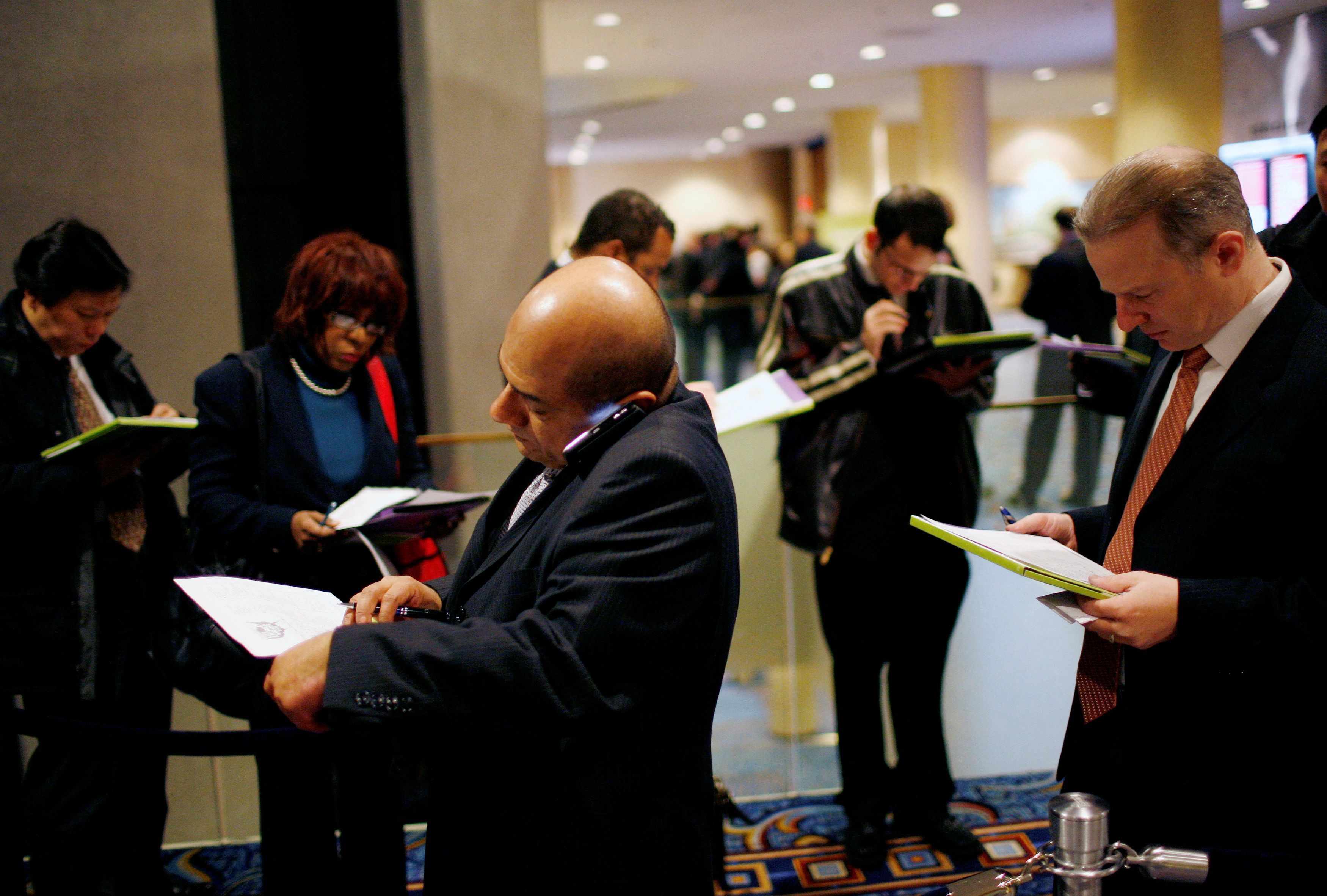 People wait on line for a job fair 