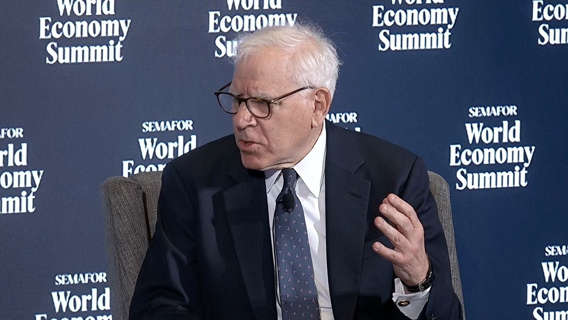 David Rubenstein on stage. 