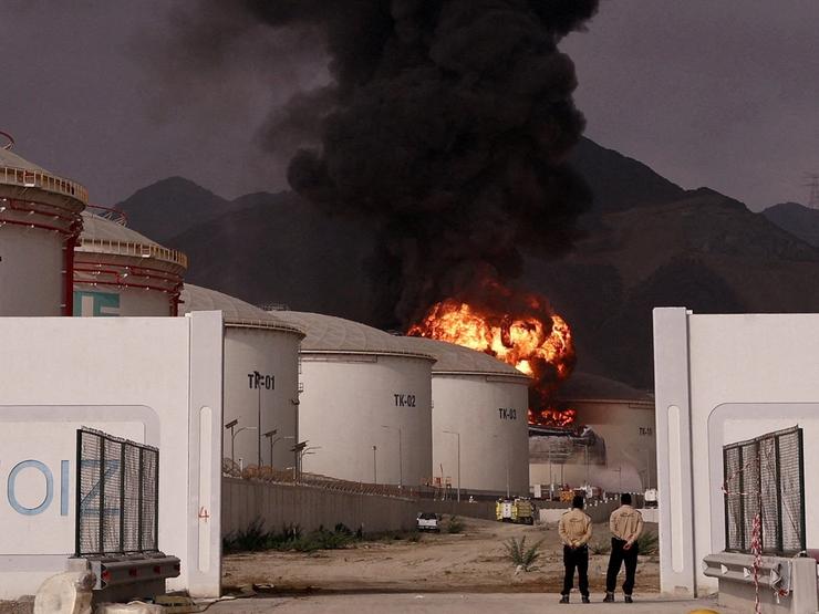 Fire and smoke rise in the Fujairah oil industry zone, caused by debris after interception of a drone by air defenses, according to the Fujairah media office, amid the U.S.-Israel conflict with Iran, in Fujairah, United Arab Emirates