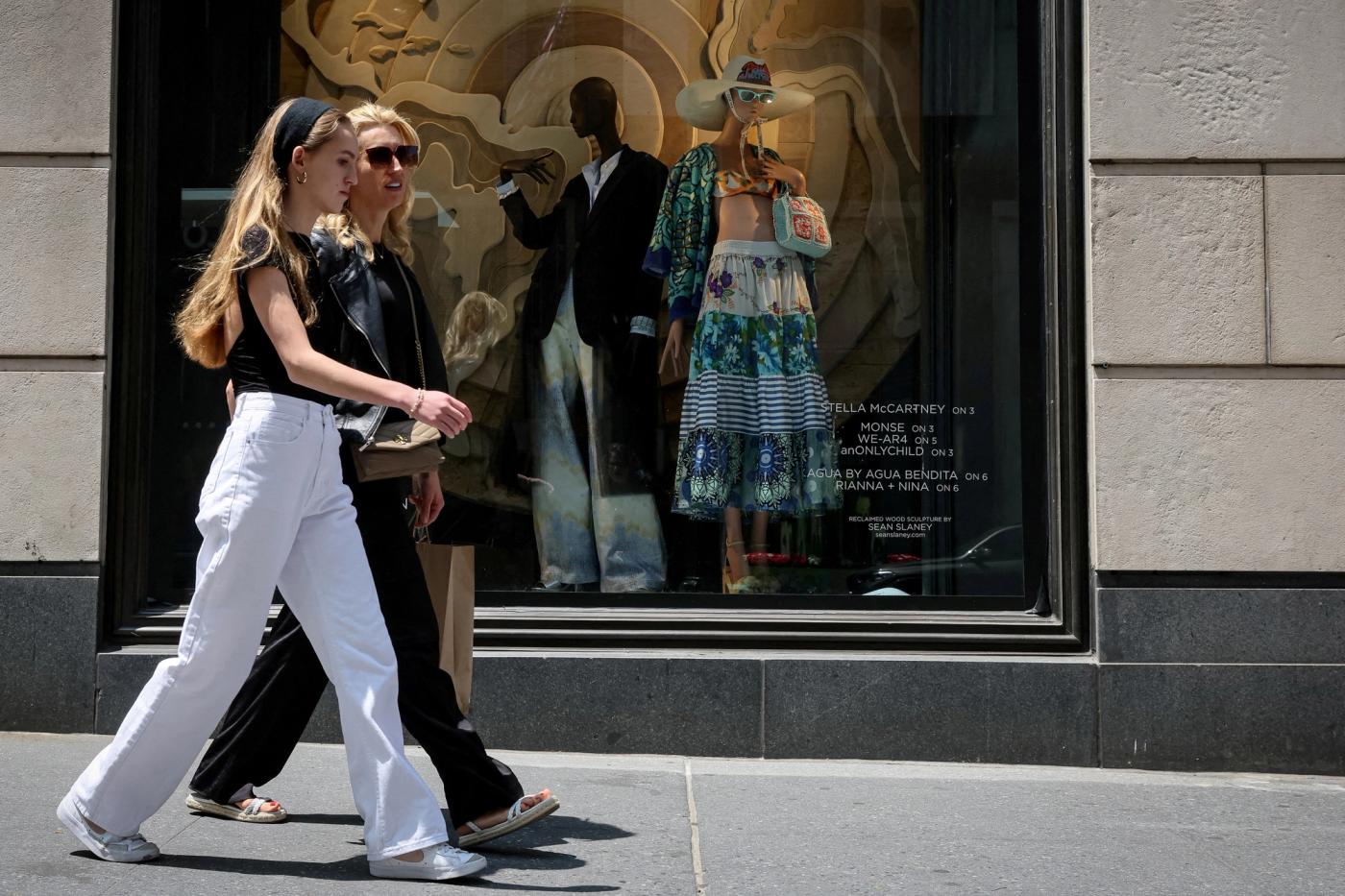 Shoppers on 5th Avenue pass by the Bergdorf Goodman store in New York City.