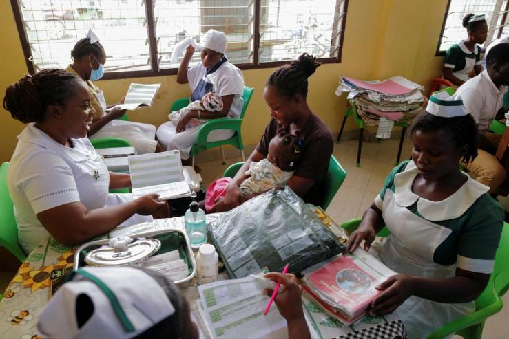 Health workers prepare to vaccinate infants at the Mother and Child Hospital in Kasoa, Ghana.