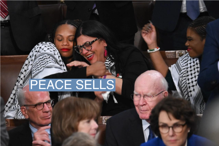 Rep. Summer Lee embraces Rep. Rashida Tlaib as President Joe Biden delivers the State of the Union address on March 7, 2024.