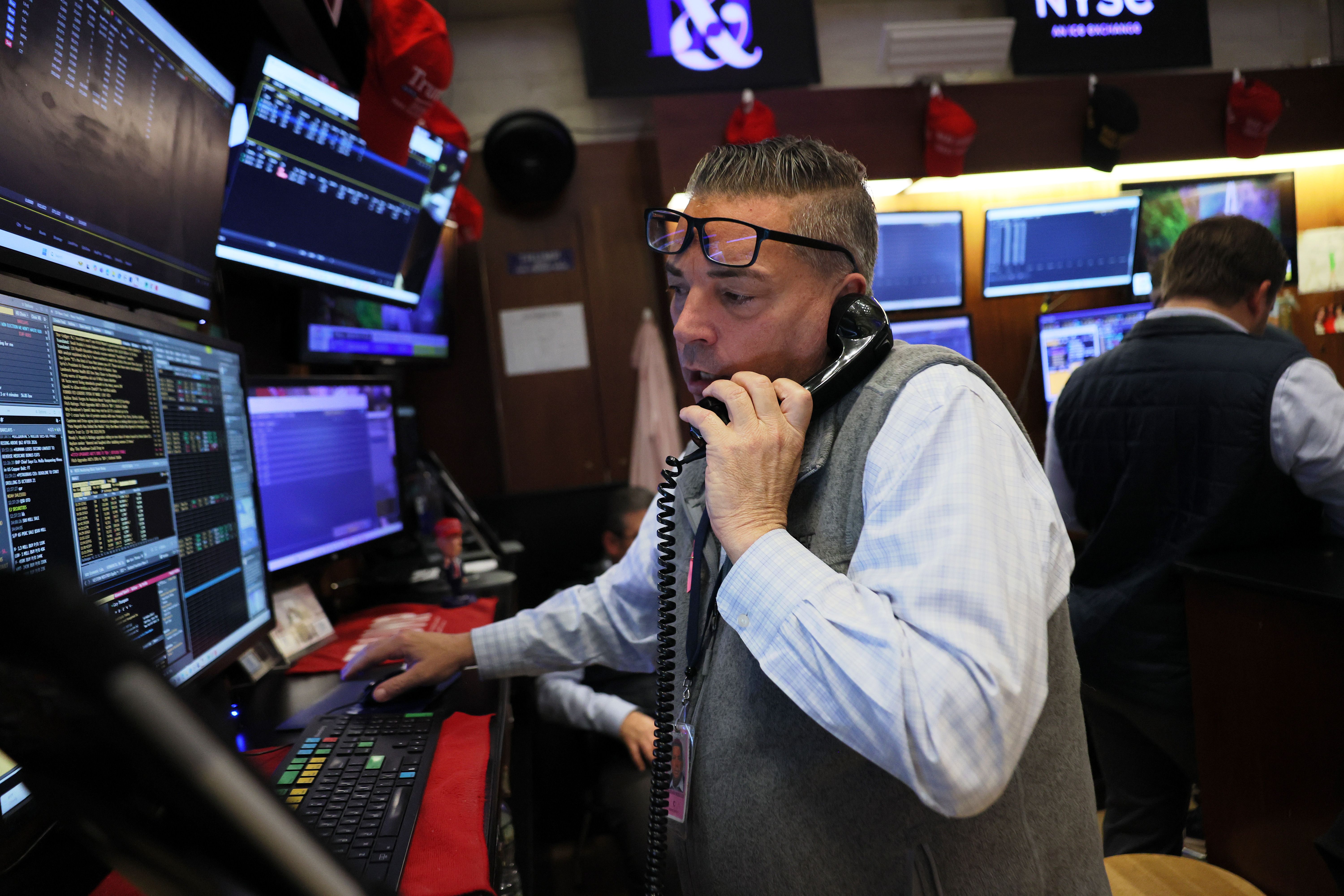 Traders work on the floor of the New York Stock Exchange during afternoon trading
