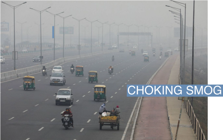 Vehicles are seen on a highway on a smoggy morning in New Delhi, India