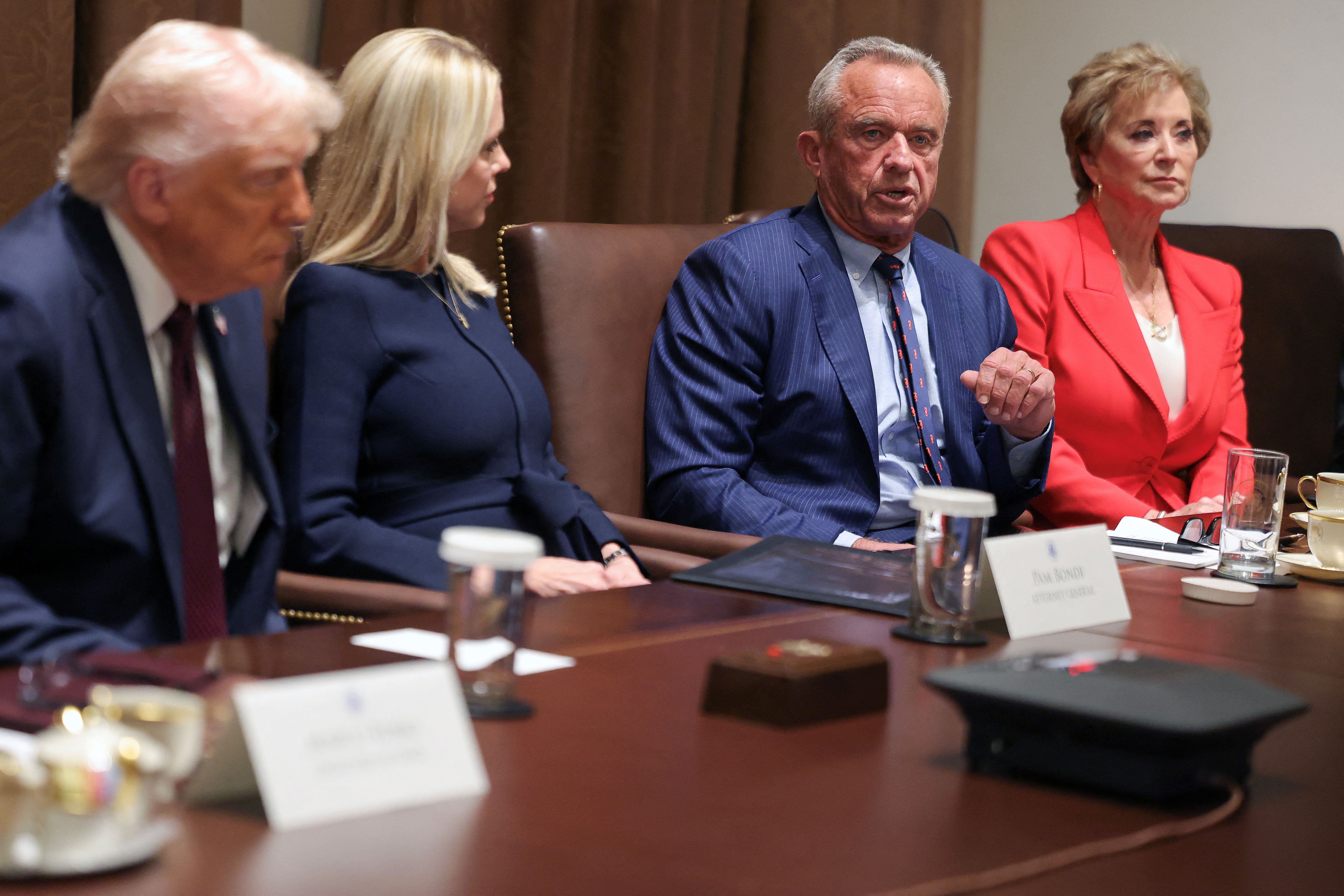 US President Donald Trump, Attorney General Pam Bondi, Health and Human Services Secretary Robert F. Kennedy Jr. and Secretary of Education Linda McMahon attend a cabinet meeting at the White House.