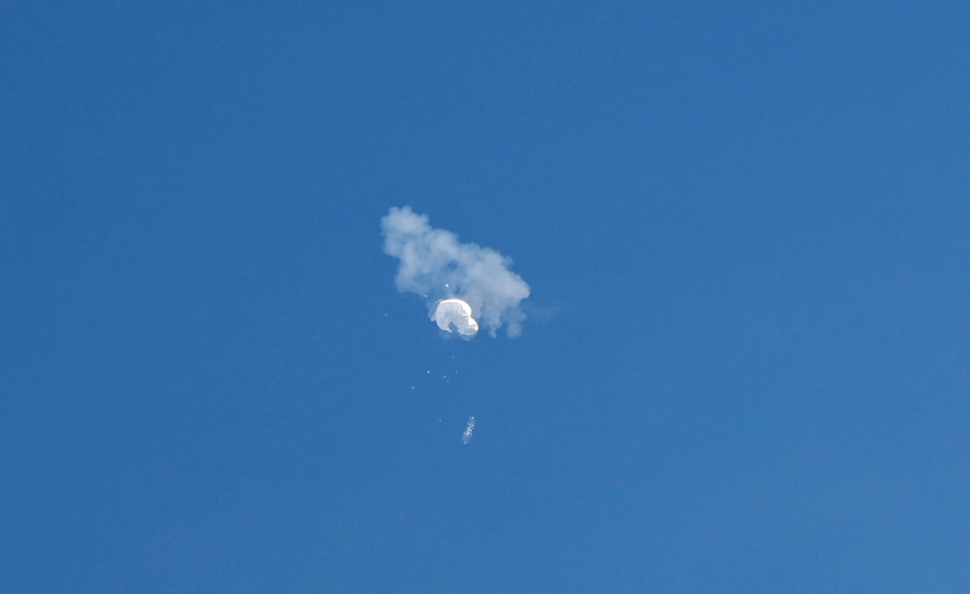 The suspected Chinese spy balloon drifts to the ocean after being shot down off the coast in Surfside Beach, South Carolina, U.S. February 4, 2023