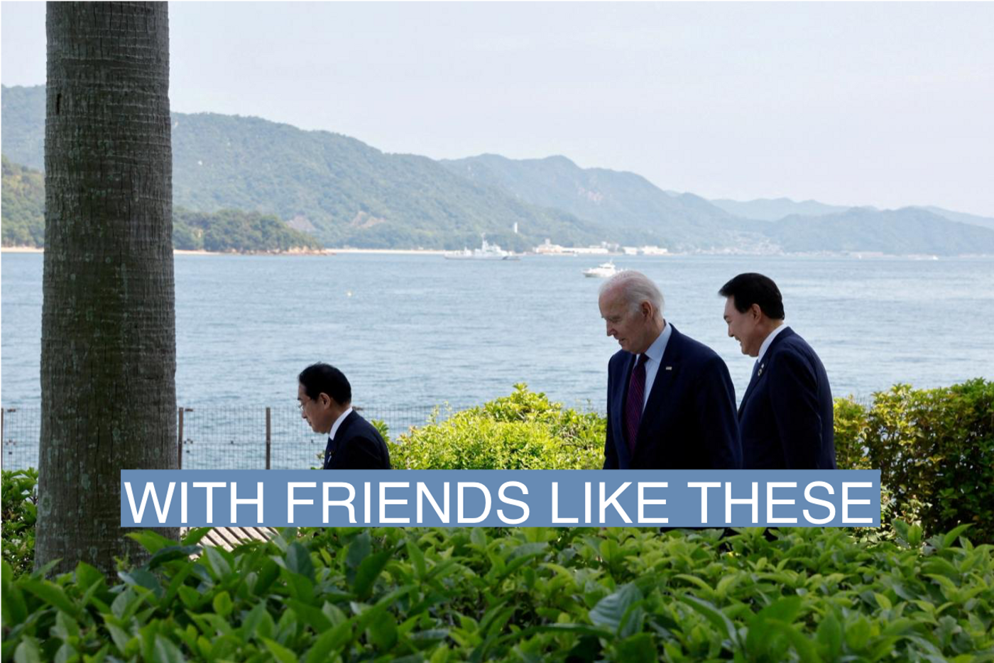 U.S. President Joe Biden walks with Japan?s Prime Minister Fumio Kishida and South Korea?s President Yoon Suk Yeol on the day of trilateral engagement during the G7 Summit at the Grand Prince Hotel in Hiroshima, Japan, May 21, 2023. 