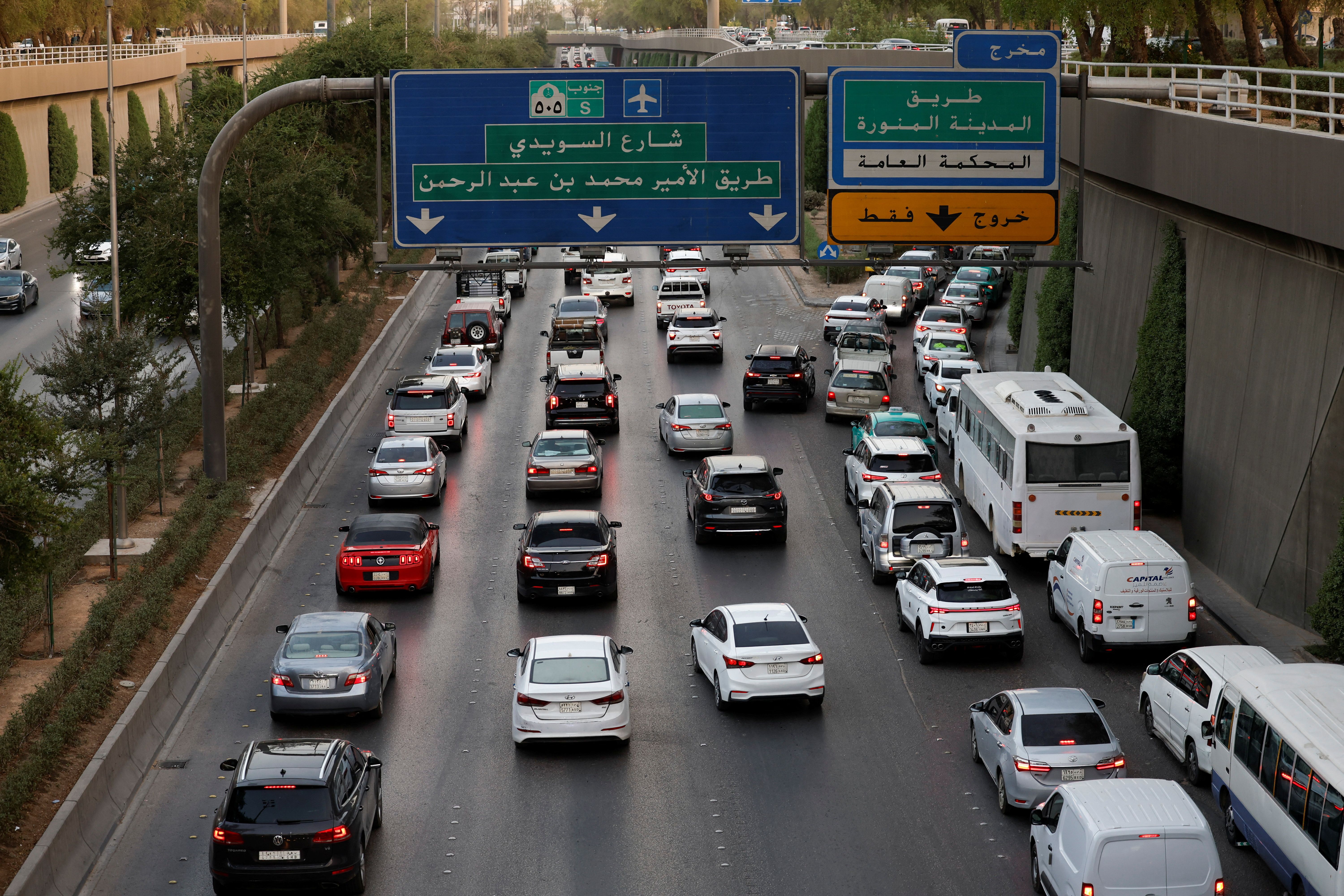 Cars drive during rush-hour on a highway leading to a local souq down town Riyadh, Saudi Arabia.