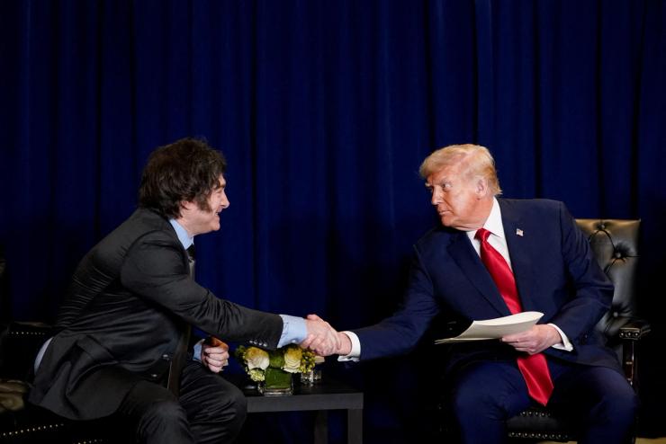 President Donald Trump shakes hands with Argentina’s President Javier Milei.