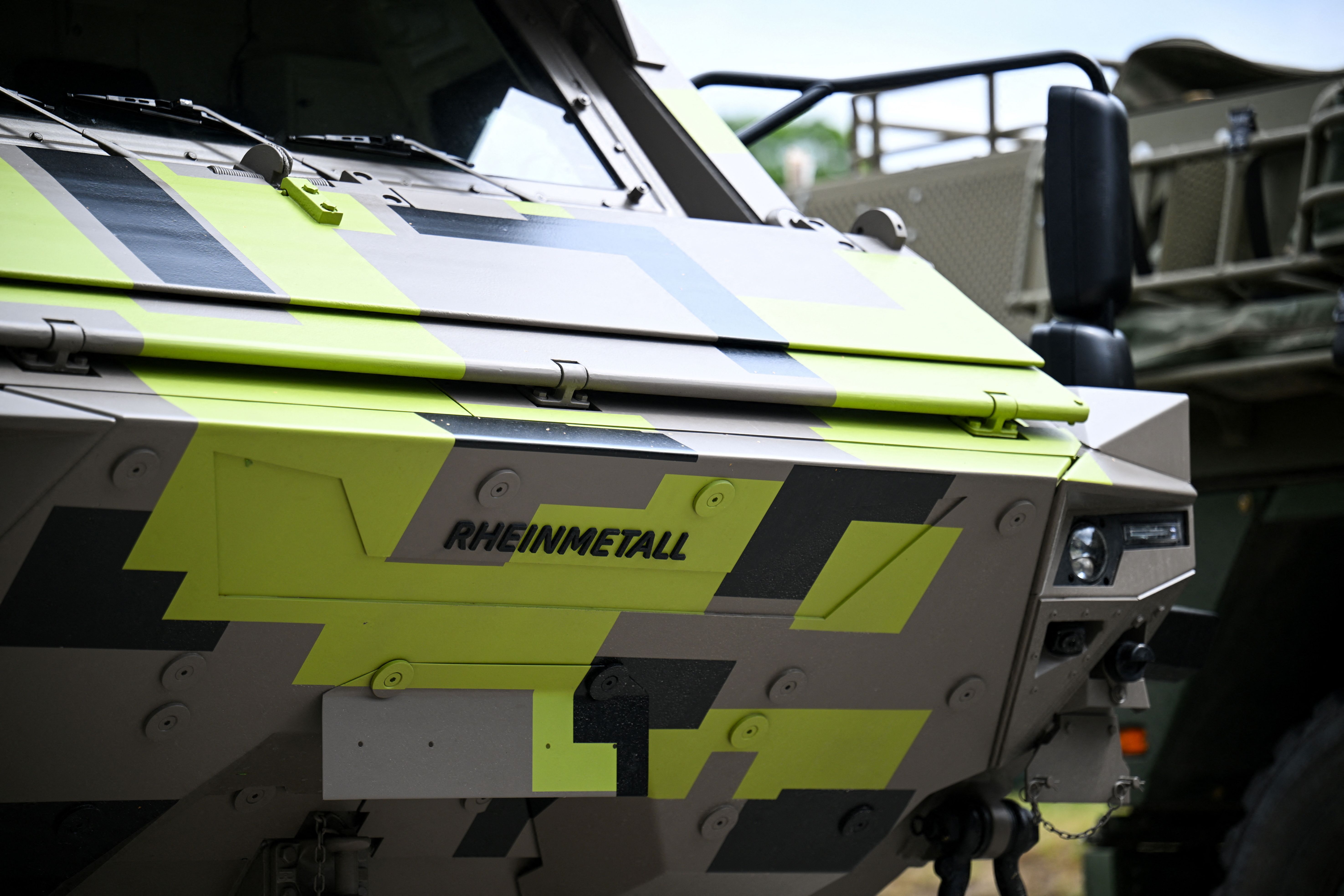 A Rheinmetall logo is seen on an armored personnel carrier.