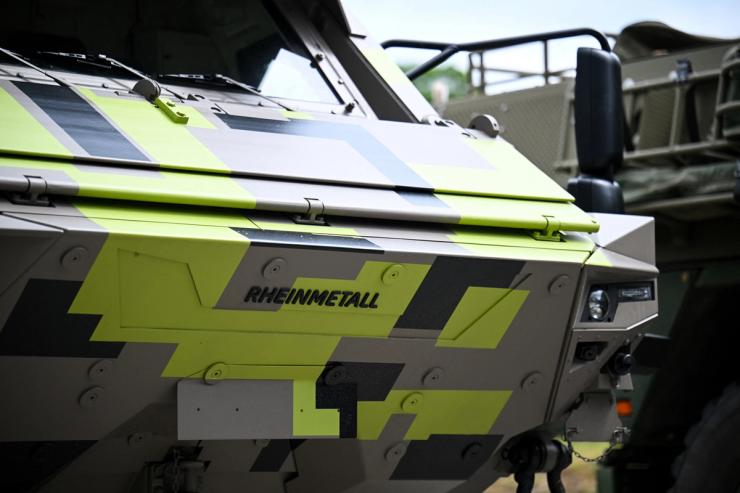 A Rheinmetall logo is seen on an armored personnel carrier.